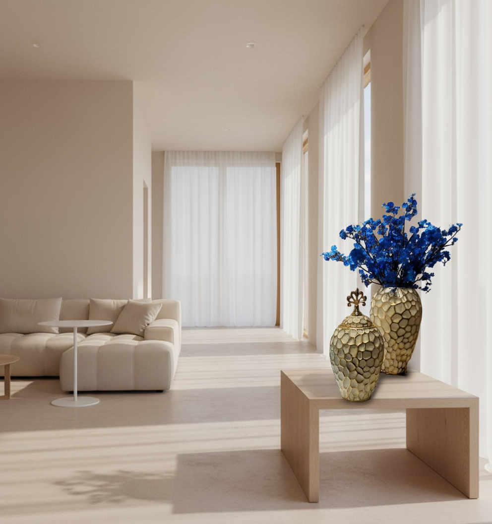 Decorative vases with a textured surface and blue flowers on a white background