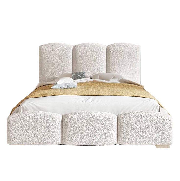 Modern bedroom with a textured bed and decorative elements.