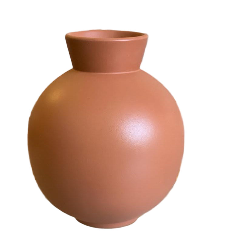Ceramic vase with a smooth finish on a reflective surface