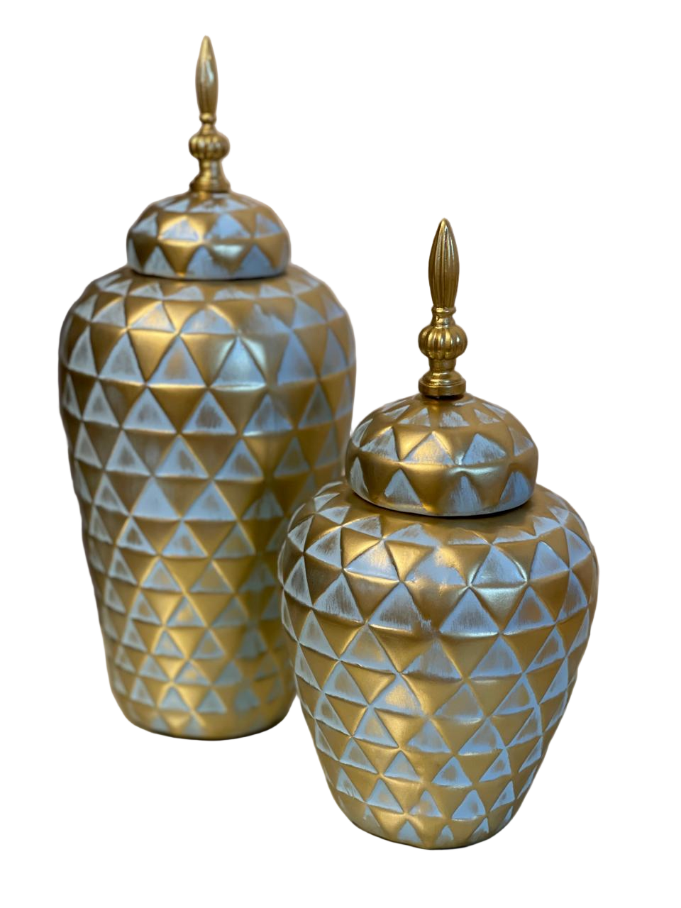 Two decorative jars with geometric patterns and gold accents on a neutral background
