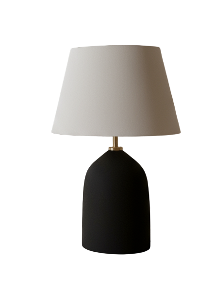 Modern interior with a black lamp on a wooden table