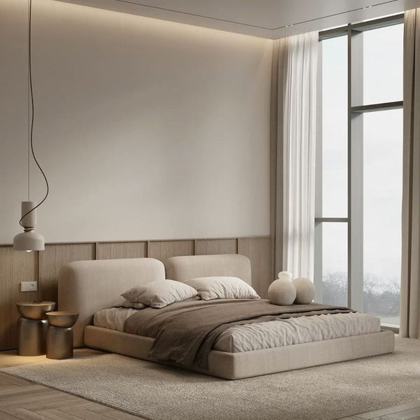 Modern bedroom with a large window, neutral color scheme, and minimal decor.