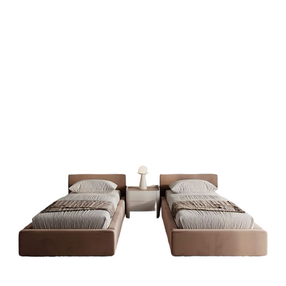 Modern bedroom with two beds against a wall with built-in lighting.