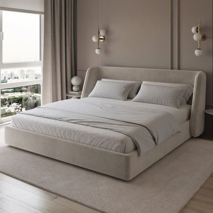 Modern bedroom with a large bed, neutral walls, and decorative elements.