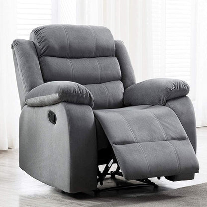 grey recliner chair in a room with light-colored curtains