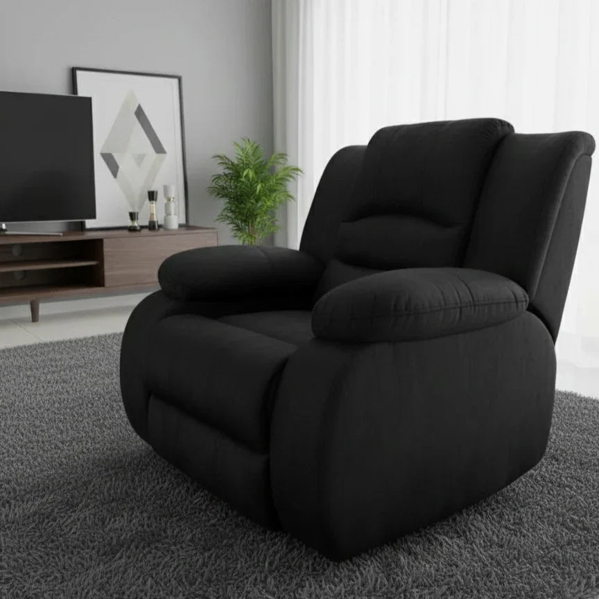 Black recliner chair in a living room setting with a TV and decor.