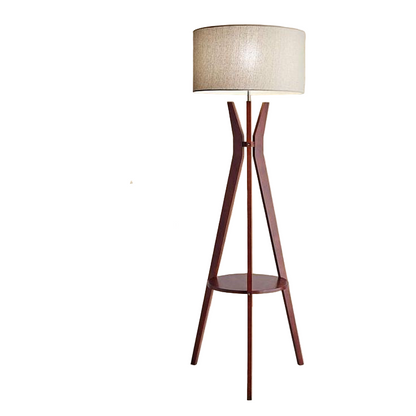 Wooden floor lamp with a beige shade in a living room setting.