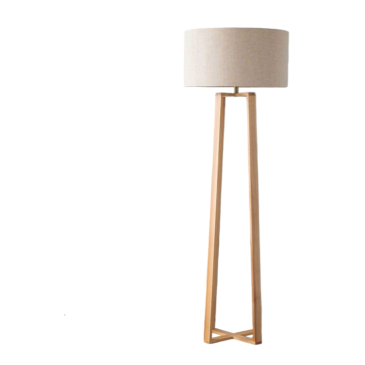 Wooden floor lamp next to a side table with decor items against a light blue wall.