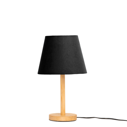 Table lamp with black shade and wooden base on a white background