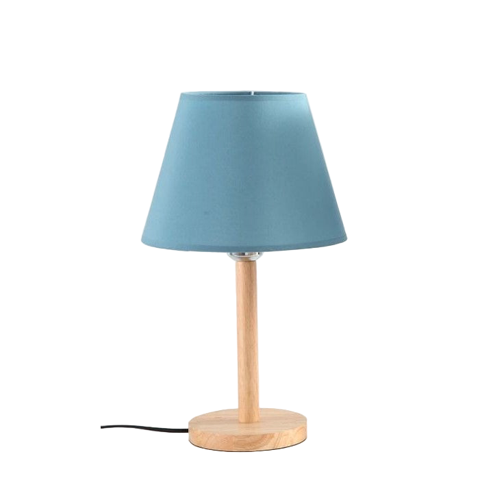 Table lamp with a blue shade and wooden base on a white background