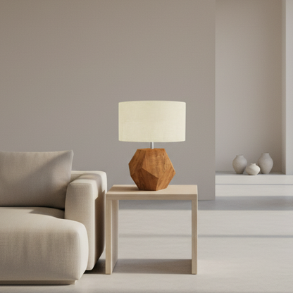 Table lamp with wooden base and beige shade on a white background