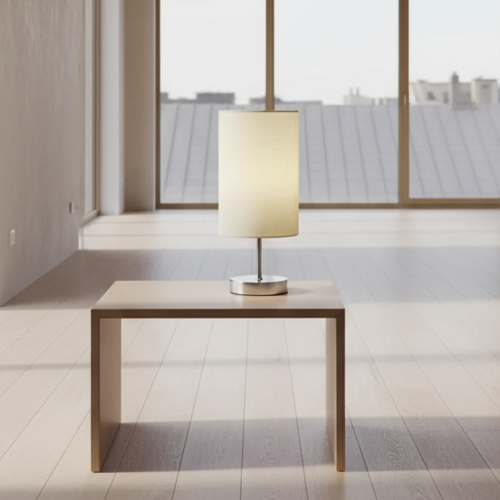 Table lamp with a beige shade on a wooden surface